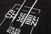 Close-up detail of Set Apart and Chosen for His Glory design on black hoodie