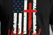 Close-up detail of One Nation Under God flag design with cross on black men's t-shirt